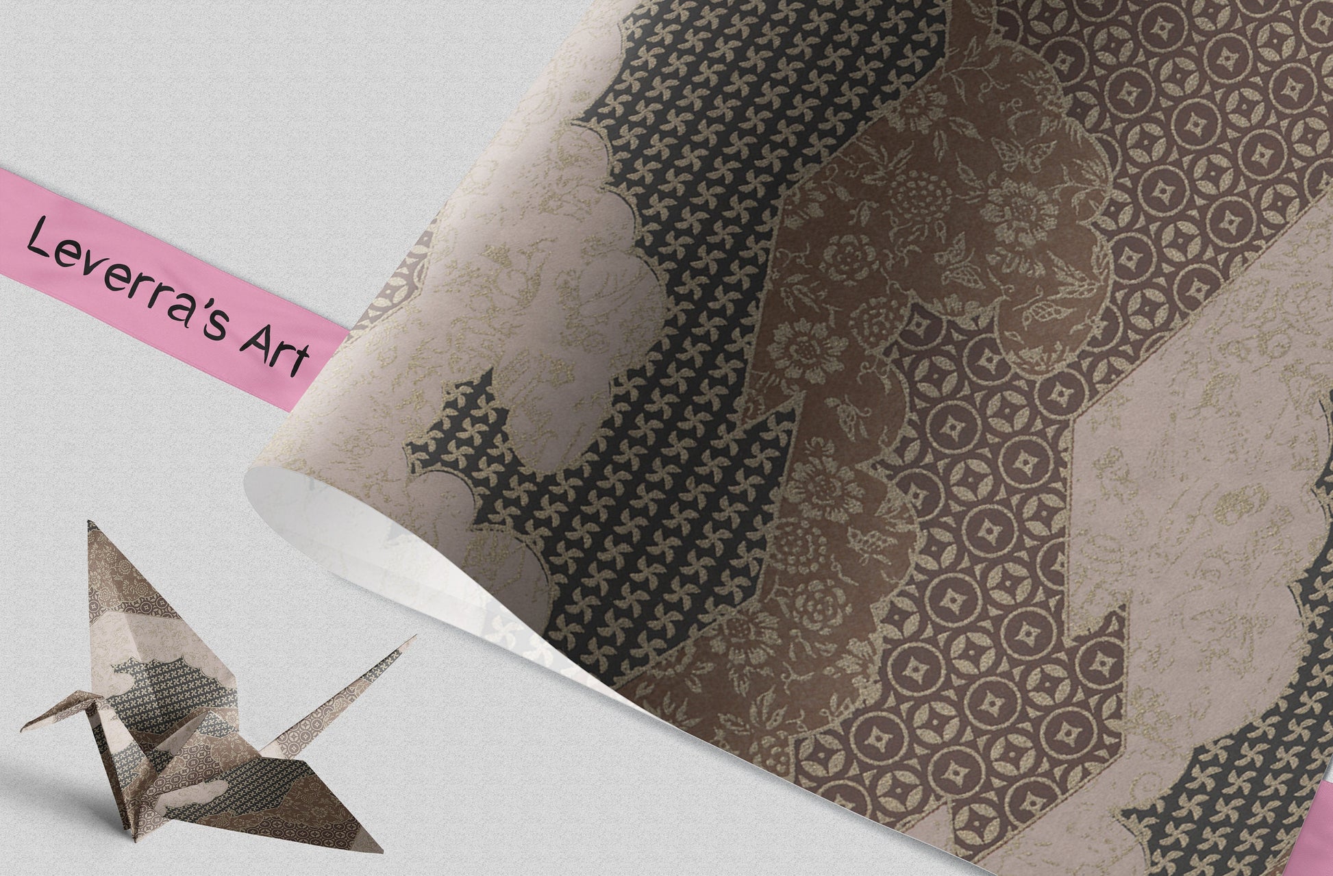 Patterned paper with a folded paper crane and 'Leverra's Art' label.
