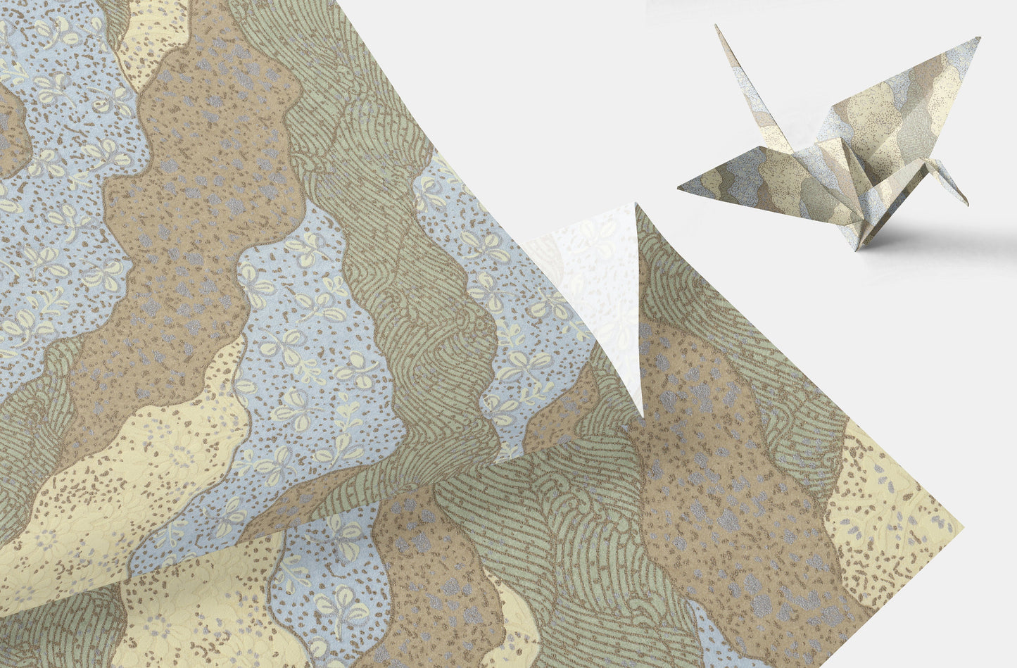 Patterned chiyogami paper with a folded paper crane on a white background
