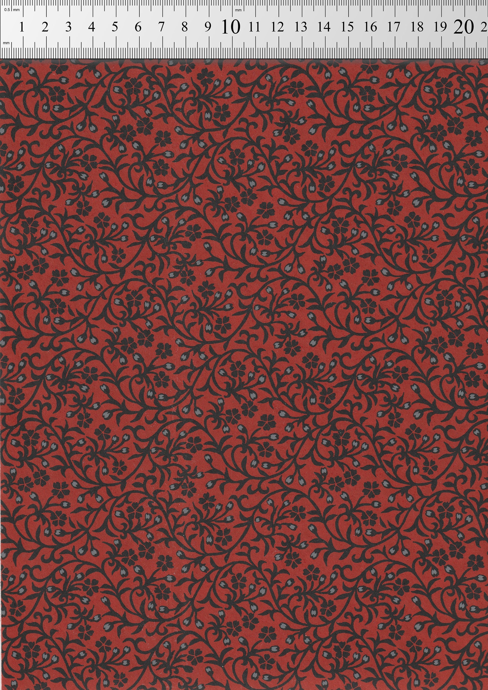 Red  chiyogami paper with black floral pattern on a red background