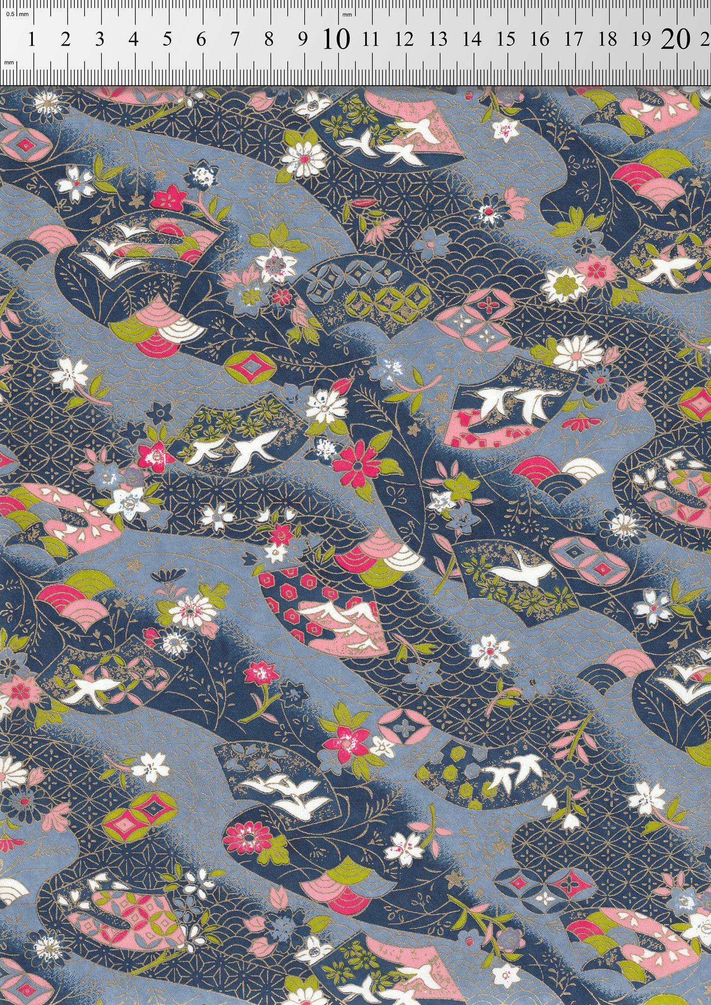 Floral and animal pattern fabric swatch with a ruler at the top