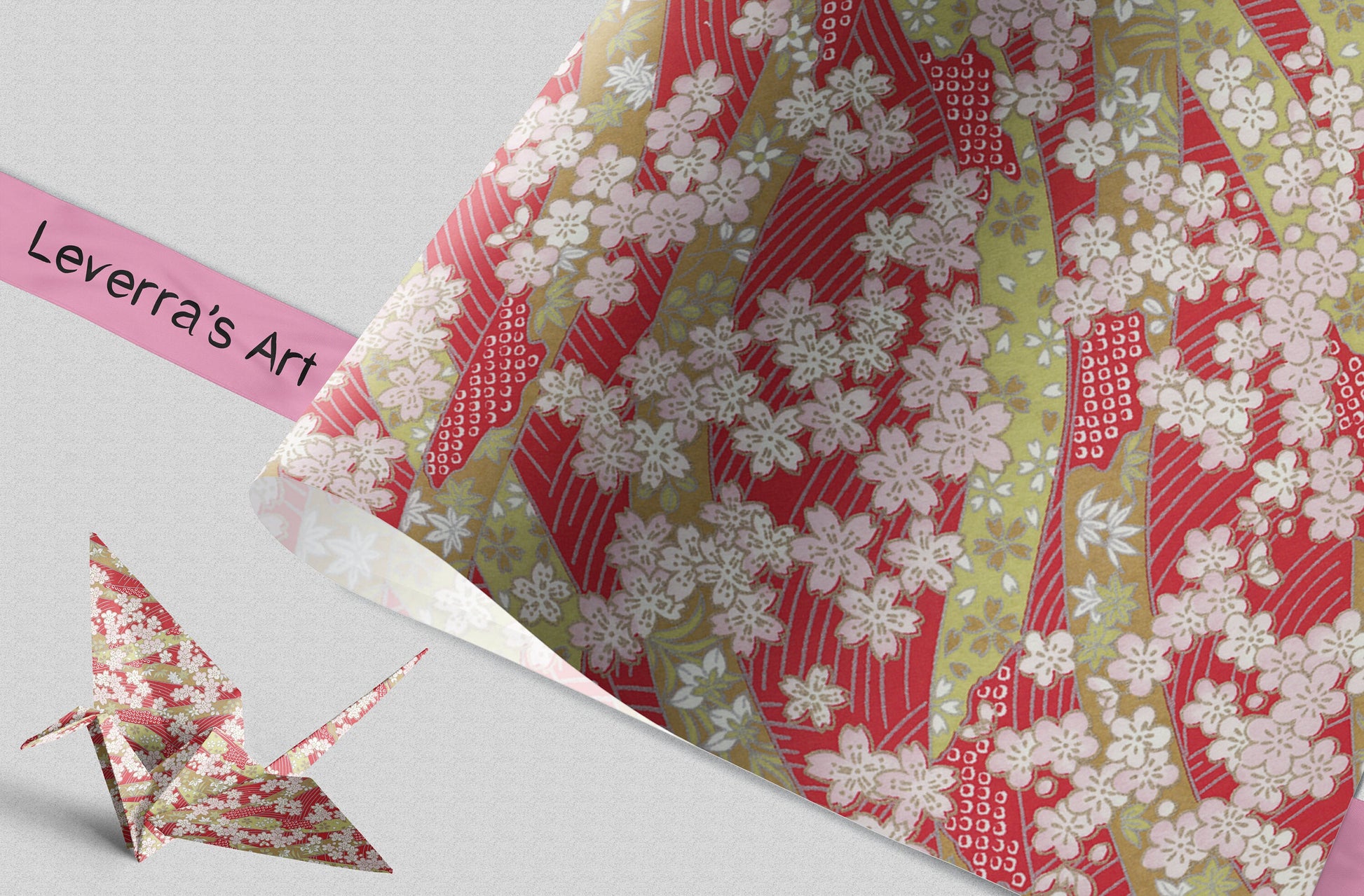 Decorative paper with floral pattern and an origami crane on a light gray background