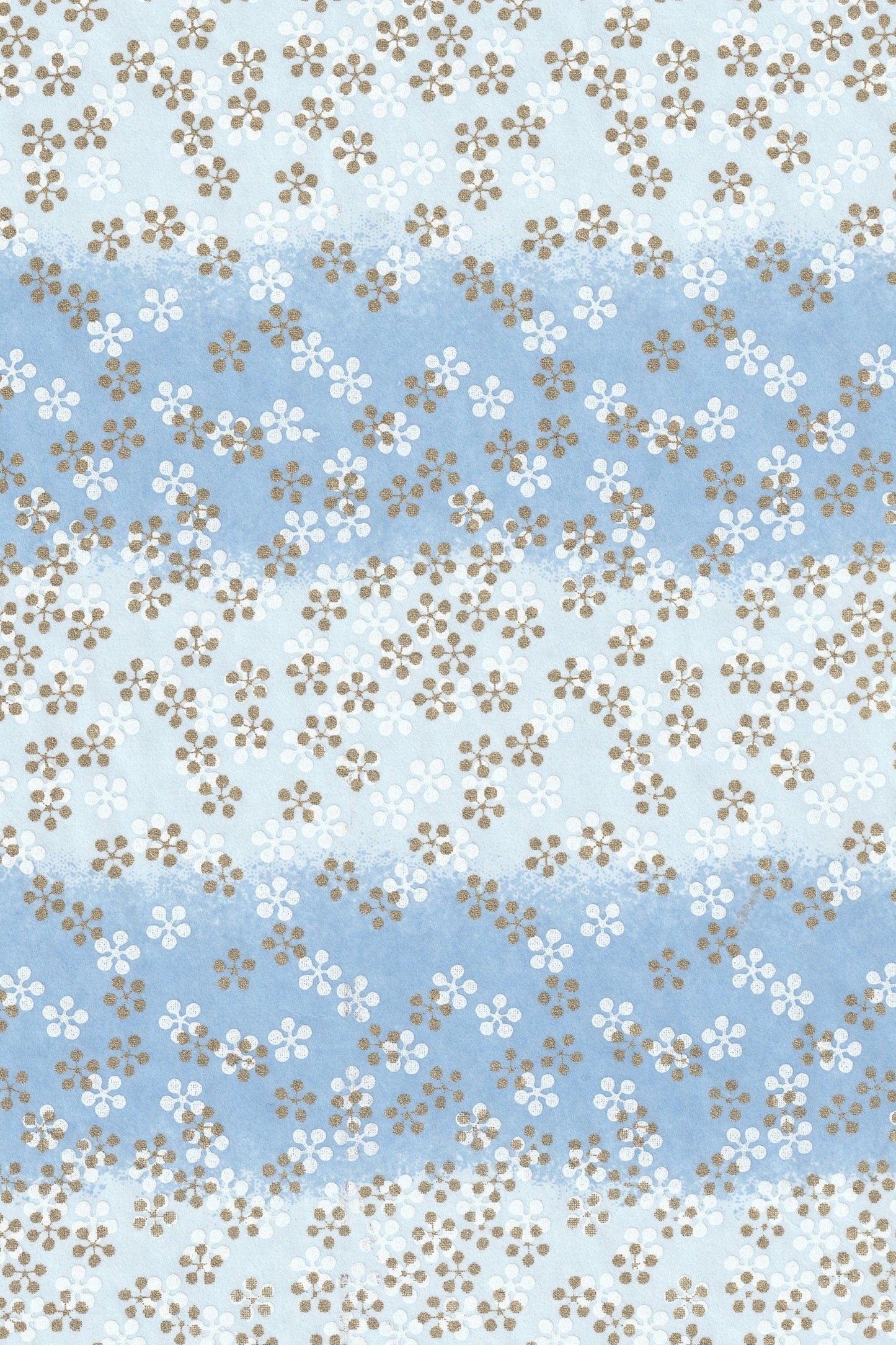 Floral patterned chiyogami paper with small flowers on a blue and white background