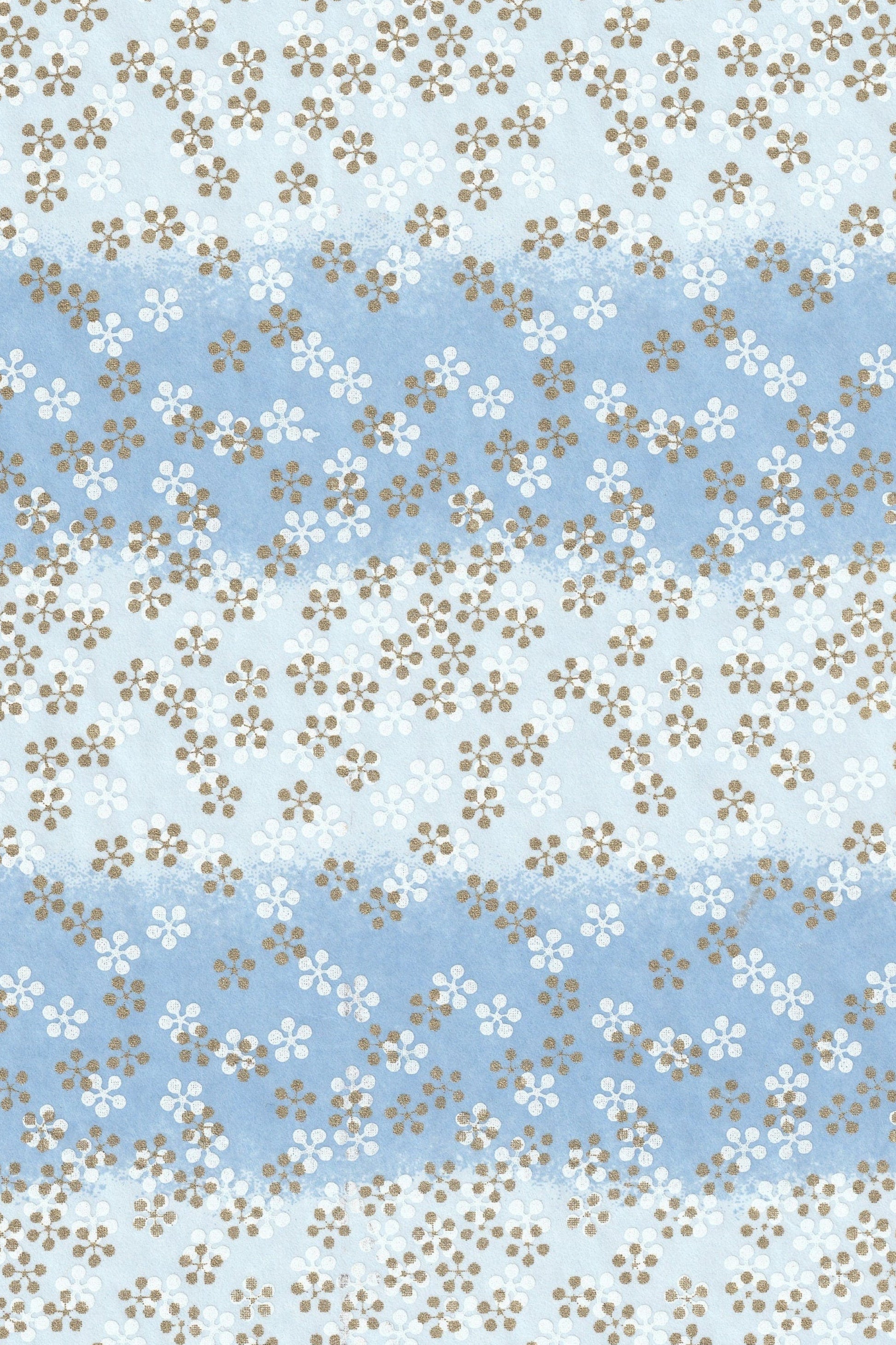 Floral patterned chiyogami paper with small flowers on a blue and white background