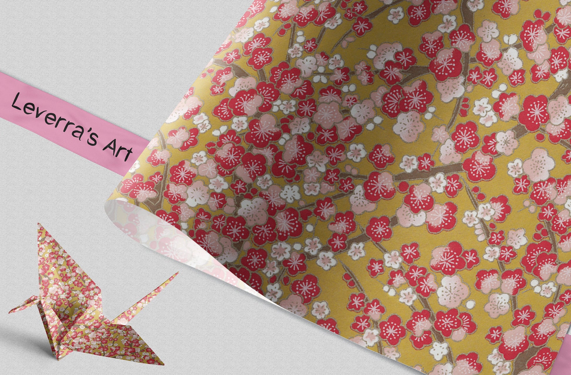 Floral patterned paper with an origami crane and a pink label reading 'Leverra's Art' on a gray background.