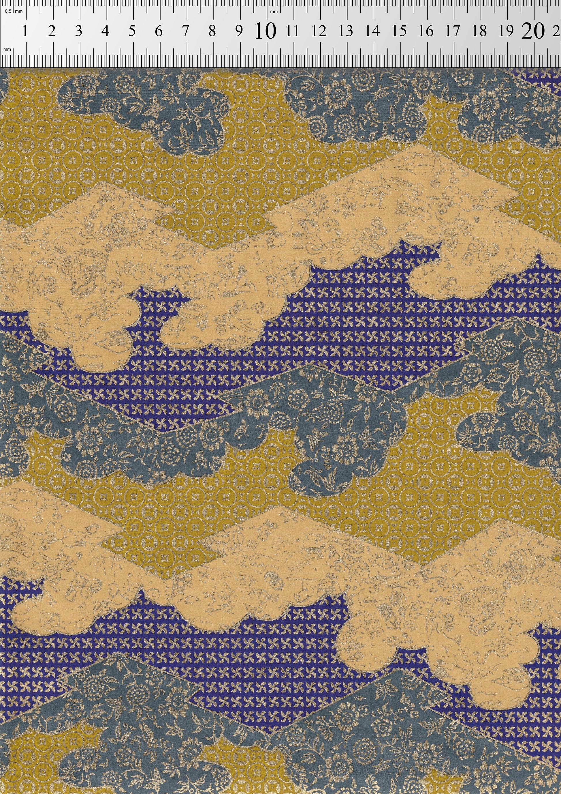 Patterned chiyogami paper with blue and beige design on a ruler background