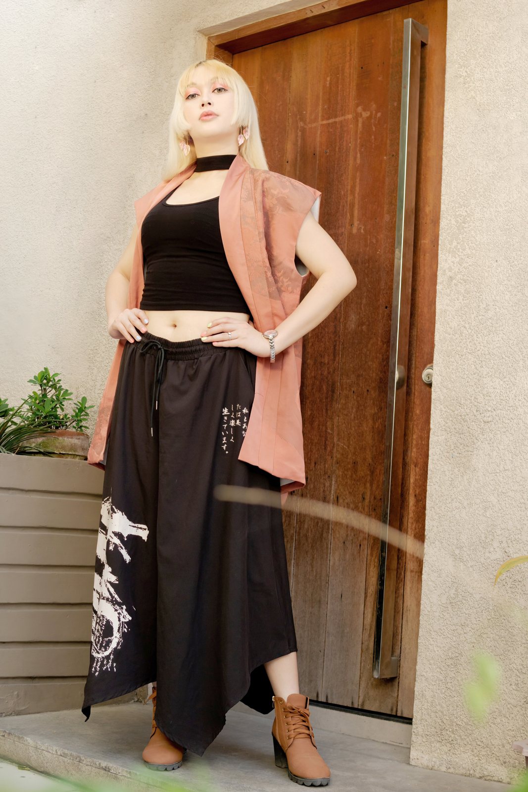 Model in an upcycled kimono vest and black wide leg kimono pants by Leverras Art